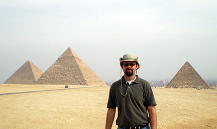 Dr. Walt in Egypt in front of the pyramids in Giza.